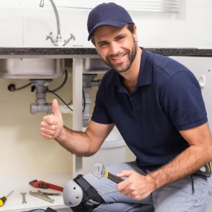 plumbing technician from copperhead plumbing performing drain cleaning procedure